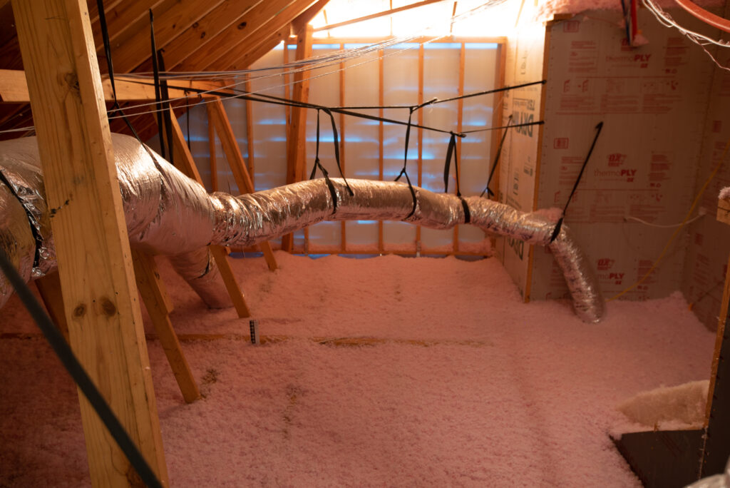 Blow-in Fiberglass insulation in an attic